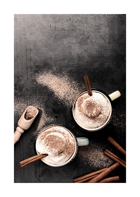  – Photograph of two cups from above, with cinnamon sticks and whipped cream in them