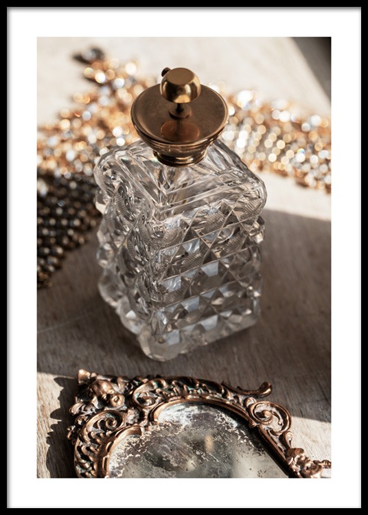  – Photograph of a retro bottle in glass with a gold lid, and a vintage mirror in front of it