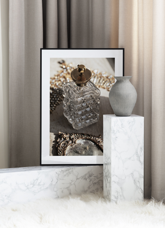  – Photograph of a retro bottle in glass with a gold lid, and a vintage mirror in front of it