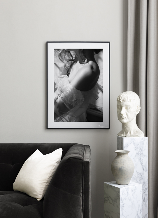  – Black and white photograph of a woman wearing a tulle dress with ruffles, showing her shoulder