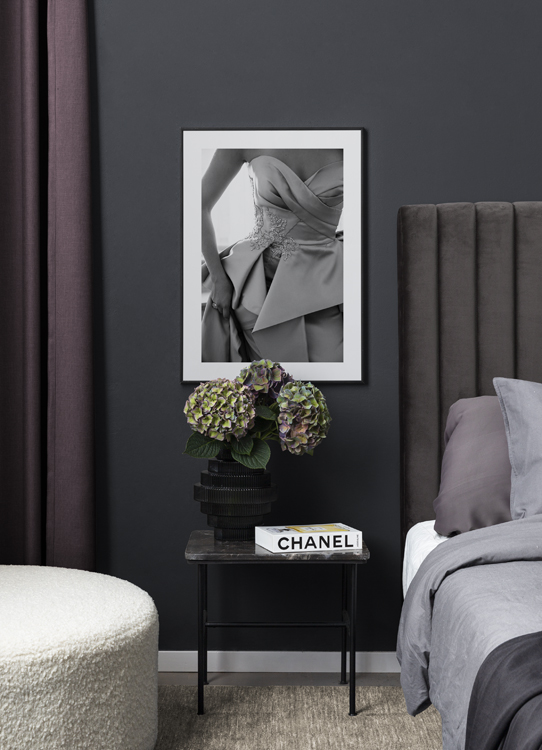  – Black and white photograph of a strapless gown with leaves embroidered at the waist