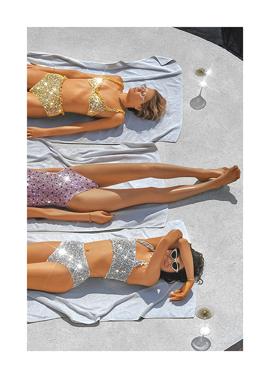  – Photograph of a group of women in sparkly sequin swimwear, sunbathing on towels