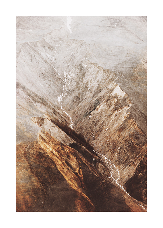  – Photograph from above of a landscape with mountains and a river running through them